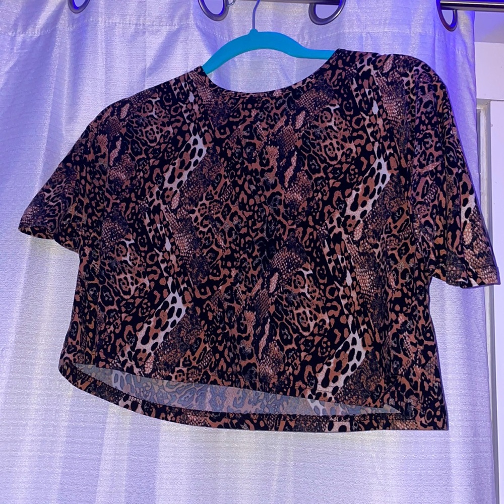 This is a crop top from French Affair in a size Small with snake skin print!!